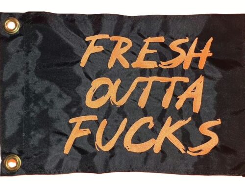 Fresh Outta Fucks safety flag with orange embroidered brush lettering on black nylon rectangle