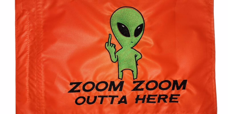 FU Alien safety flag with fluorescent green embroidered alien middle finger and black Zoom Zoom Outta Here text on orange nylon rectangle with whip sleeve
