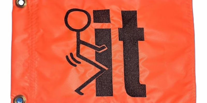 Fuck It safety flag with black embroidered stick figure graphic on orange nylon rectangle