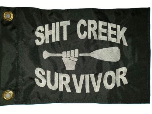 Shit creek survivor safety flag with dense embroidered white text and paddle graphic on black nylon rectangle with solid brass grommets