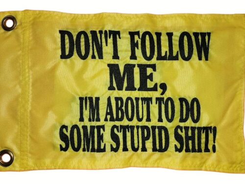 Don't follow me safety flag with dense embroidered black text on yellow nylon rectangle with solid brass grommets