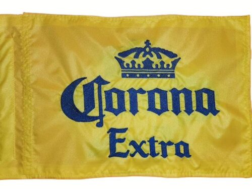 Corona Extra safety flag with dense embroidered royal blue crown logo and text on yellow nylon rectangle with whip sleeve