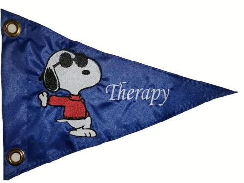 Snoopy safety flag with embroidered dog wearing sunglasses and red sweater with Therapy text on royal blue nylon pennant with brass grommets