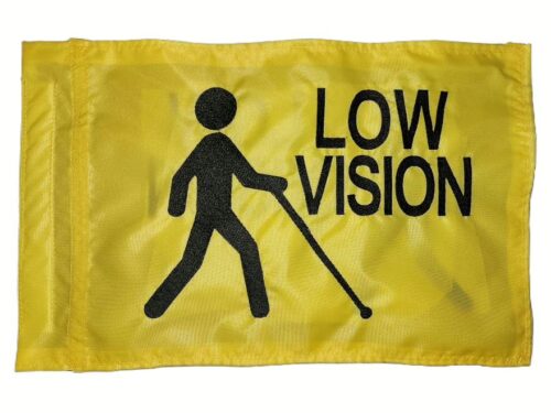 Low vision safety flag with dense embroidered black figure using a cane and text on yellow nylon rectangle with whip sleeve