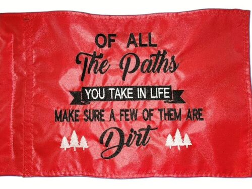 Dirt Paths safety flag with dense embroidered black text and white trees on red nylon rectangle with whip sleeve
