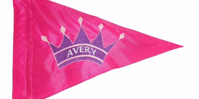 Custom Princess Crown safety flag with purple embroidered tiara and personalized name on hot pink nylon pennant with whip sleeve
