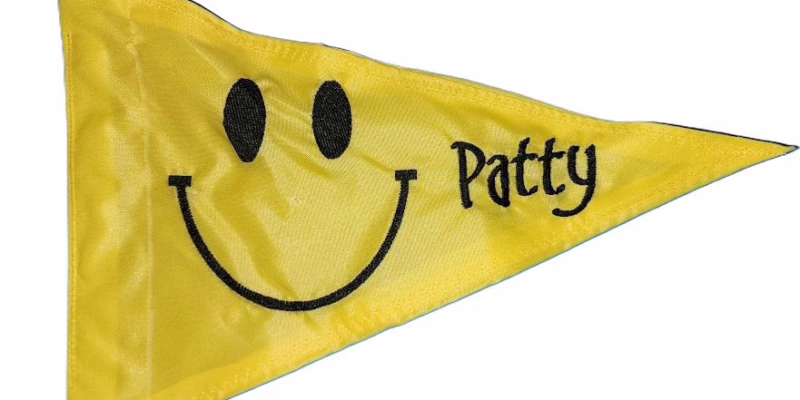 Retro Smiley Face safety flag with custom embroidered Patty name and happy face on yellow nylon pennant