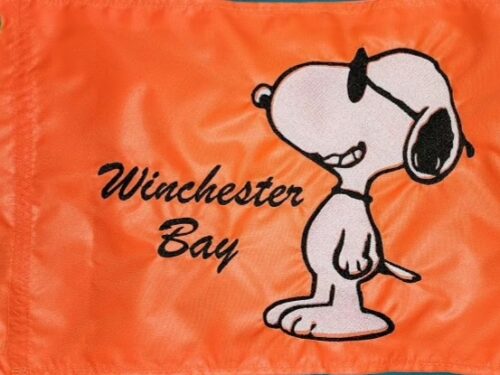 Snoopy safety flag with embroidered dog wearing sunglasses and Winchester Bay custom text on bright orange nylon rectangle with brass grommets