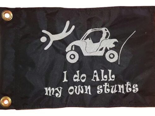 I Do All My Own Stunts UTV safety flag with embroidered flying driver and side-by-side on black nylon rectangle with brass grommets