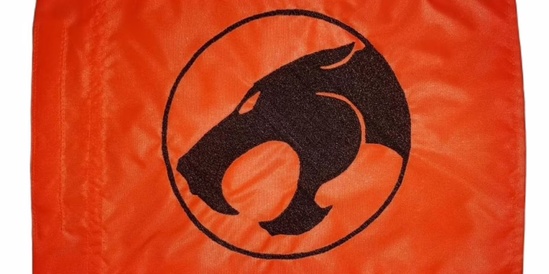 ThunderCats logo safety flag with dense embroidered roaring cat silhouette in circular emblem on nylon rectangle with whip sleeve