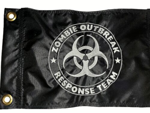 Zombie Outbreak Response Team safety flag with dense embroidered white biohazard logo on black nylon rectangle with solid brass grommets