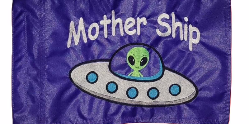 Alien Spaceship safety flag with green alien flying saucer and white Mother Ship text on purple nylon rectangle with whip sleeve