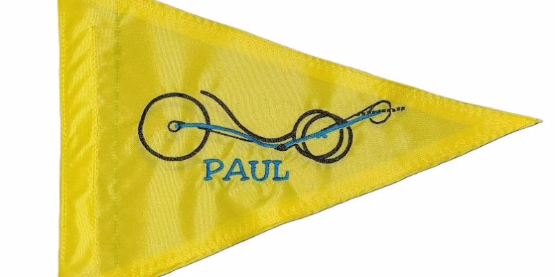 Artsy Recumbent Trike safety flag with embroidered frame outline and personalized name Paul on safety yellow nylon pennant with whip sleeve