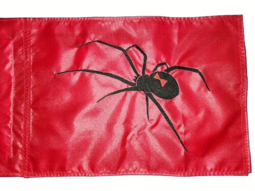 Black Widow spider safety flag with dense embroidered arachnid silhouette and red hourglass on nylon rectangle with whip sleeve