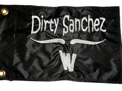 Dirty Sanchez safety flag with dense embroidered white text, mustache, and W graphic on black nylon rectangle with solid brass grommets