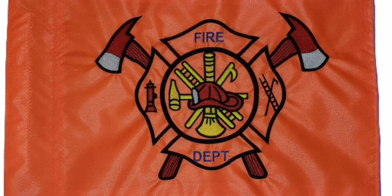 Fire Department safety flag with dense embroidered classic Maltese cross logo with crossed axes on orange nylon rectangle with whip sleeve