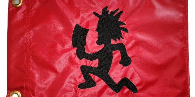 Hatchetman safety flag with dense embroidered running silhouette on nylon rectangle with brass grommets
