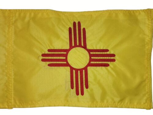 New Mexico safety flag with dense embroidered red Zia sun symbol on yellow nylon rectangle with whip sleeve