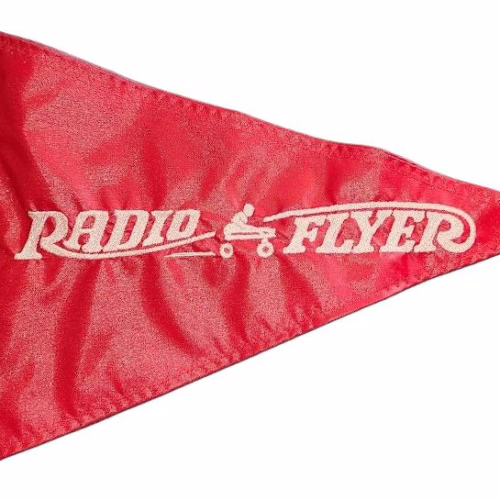 Radio Flyer safety flag with dense embroidered white vintage wagon logo on red nylon pennant with whip sleeve