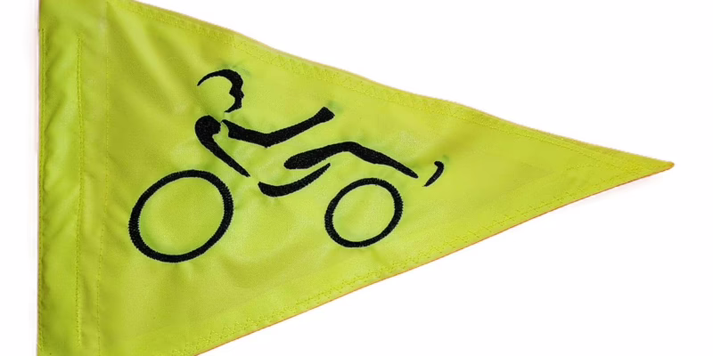 Road cyclist safety flag with embroidered black bicycle racer on lime squeeze nylon pennant with whip sleeve