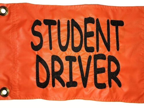 Student Driver safety flag with embroidered black stacked block lettering on bright orange nylon rectangle with brass grommets