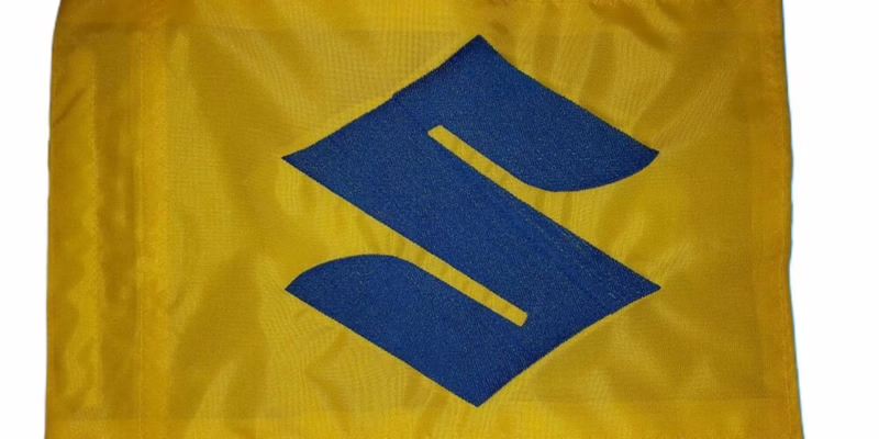 Suzuki S logo safety flag with bright blue embroidered emblem on yellow nylon rectangle with whip sleeve