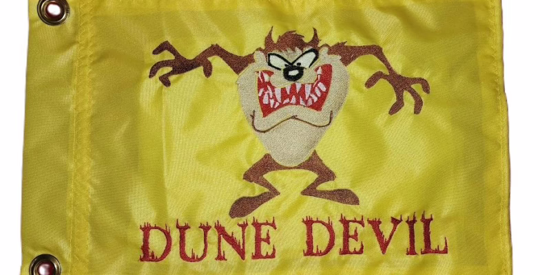 Tasmanian Devil safety flag with dense embroidered fierce cartoon character and Dune Devil text on nylon rectangle with brass grommets