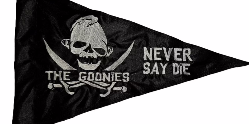 The Goonies Sloth Never Say Die safety flag with dense embroidered silver skull and crossbones and custom text on black nylon pennant with whip sleeve