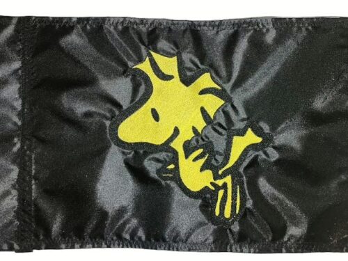 Woodstock safety flag with embroidered yellow bird on black nylon rectangle with whip sleeve