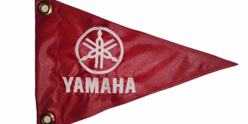 Yamaha safety flag with double sided silver embroidered tuning fork logo on red nylon pennant