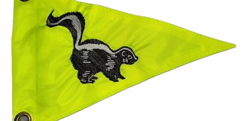 Skunk safety flag with dense embroidered black and grey skunk on Lime Squeeze nylon pennant with solid brass grommets