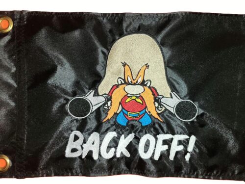 Yosemite Sam Back Off safety flag with embroidered gunslinger and white lettering on black nylon rectangle with brass grommets