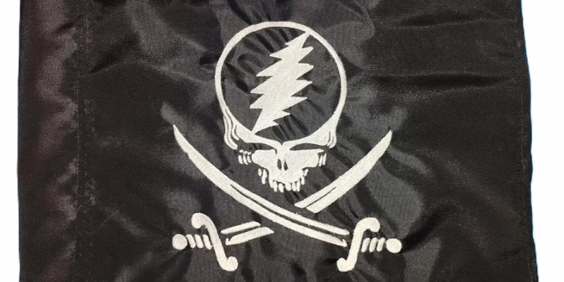 Grateful Dead pirate safety flag with embroidered Steal Your Face skull and crossed cutlasses on black nylon rectangle with whip sleeve