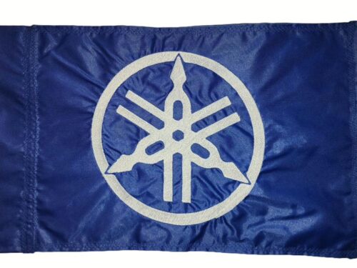 Yamaha safety flag with embroidered white tuning forks emblem on royal blue nylon rectangle with whip sleeve