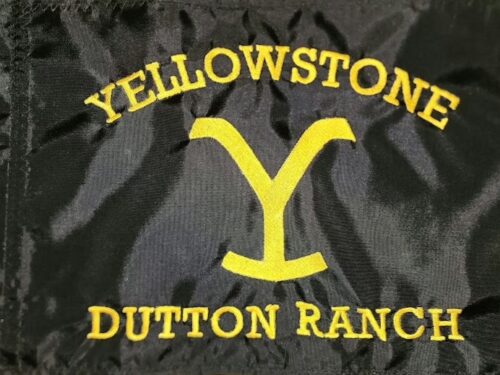 Yellowstone Dutton Ranch safety flag with dense embroidered yellow hooked Y brand and text on black nylon rectangle with whip sleeve