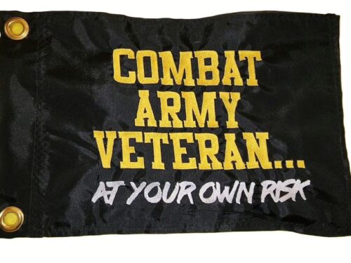 Combat army veteran safety flag made by Devil Woman Flags with dense embroidered yellow "COMBAT ARMY VETERAN..." and white "AT YOUR OWN RISK" text graphics on black nylon rectangle with solid brass grommets