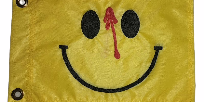 Watchmen Smiley Face safety flag with black embroidered smiling face and dripping red blood on yellow nylon rectangle