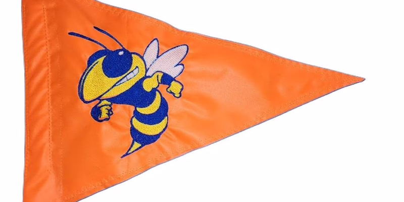 Yellow jacket hornet safety flag with dense embroidered blue and yellow angry hornet mascot on orange nylon pennant with whip sleeve