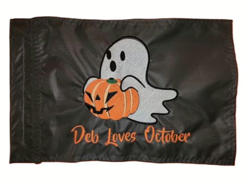 Alt Text: Halloween ghost safety flag with dense embroidered ghost holding a jack-o-lantern and custom text on black nylon rectangle with whip sleeve