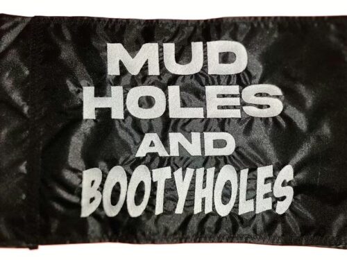 Mud holes and bootyholes safety flag with dense embroidered white text on black nylon rectangle with whip sleeve