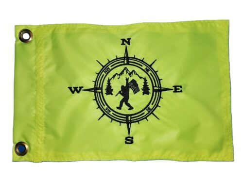 Bigfoot compass safety flag with embroidered black navigation compass mountains and trees on lime squeeze green nylon rectangle with brass grommets