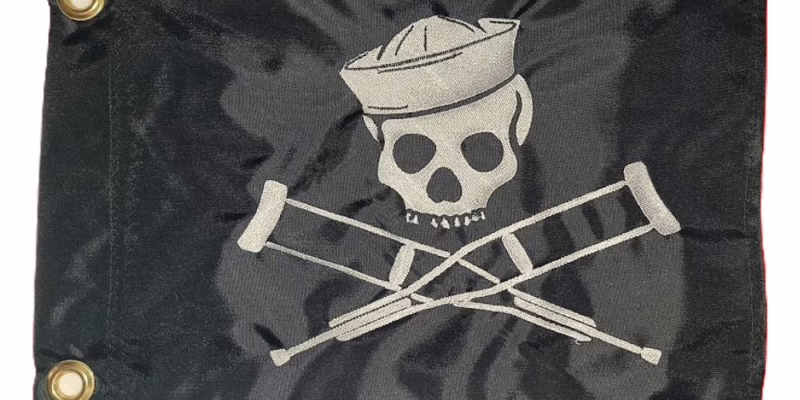 Jackass Sailor Skull safety flag with white embroidered skull in sailor hat and crossed crutches on black nylon rectangle