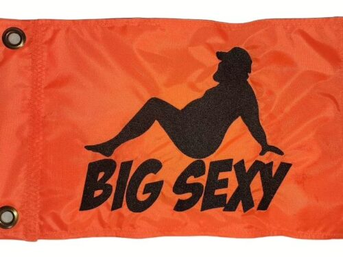Big Sexy safety flag with dense embroidered black reclining bearded man silhouette and text on orange nylon rectangle with solid brass grommets