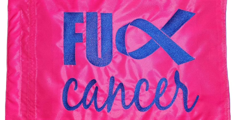 Fuck Cancer ribbon safety flag with royal blue embroidered ribbon and script lettering on pink nylon rectangle