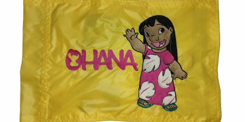 Lilo Ohana safety flag with dense embroidered waving character and Ohana text on nylon rectangle with whip sleeve