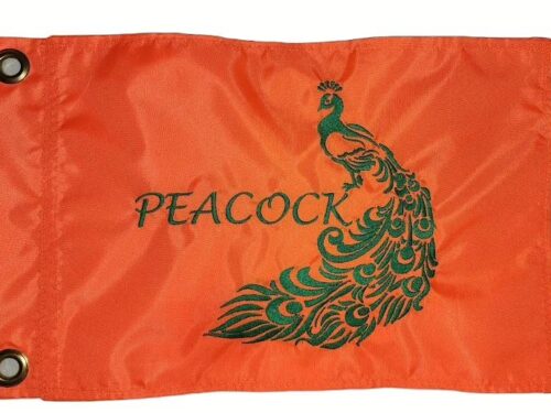 Peacock safety flag with dense embroidered green peacock graphic and text on orange nylon rectangle with solid brass grommets