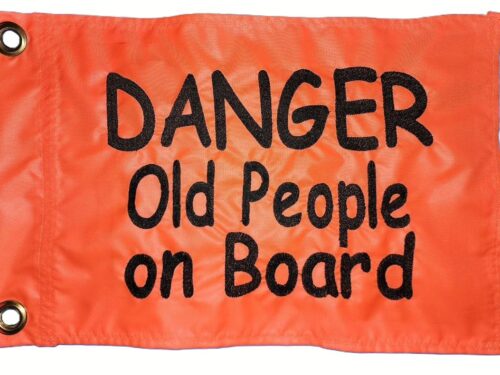 Danger old people on board safety flag made by Devil Woman Flags with dense embroidered black "DANGER Old People on Board" text graphic on high-visibility orange nylon rectangle with solid brass grommets