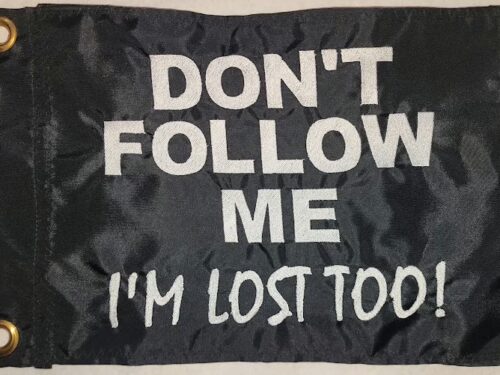 Don't follow me im lost too safety flag made by Devil Woman Flags with dense embroidered white text graphic on black nylon rectangle with solid brass grommets