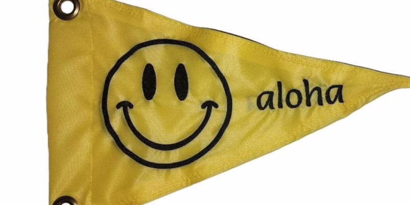 Retro Smiley Face safety flag with black embroidered smiling face and text on yellow nylon pennant