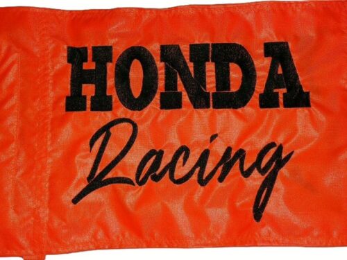Honda Racing safety flag with embroidered black block and script lettering on orange nylon rectangle with whip sleeve